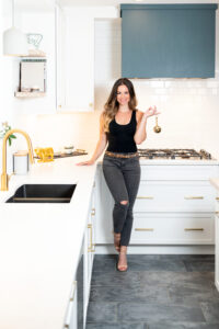 Woman in kitchen for cook book photo shoot