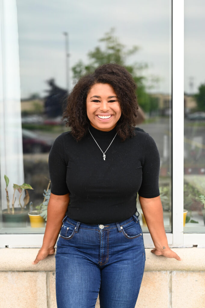 Entrepreneur smiling during relaxed brand photoshoot