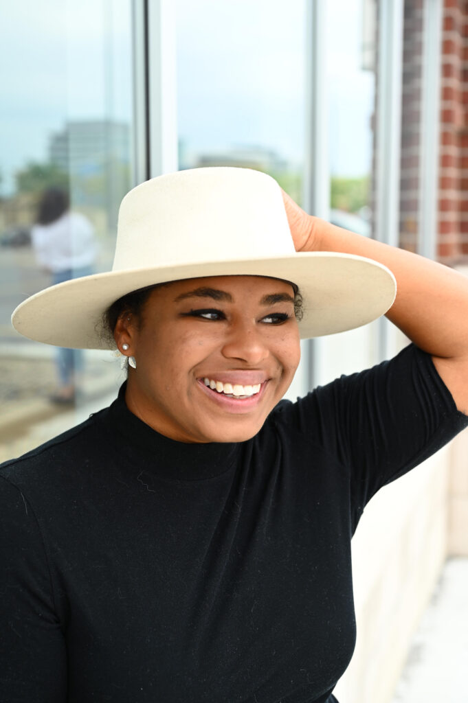 Entrepreneur smiling during relaxed brand photoshoot